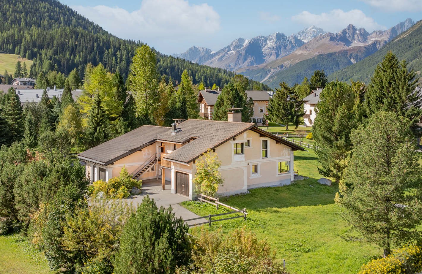 2 story house, brown roof, beige walls, garage, open front yard, scenic mountain view