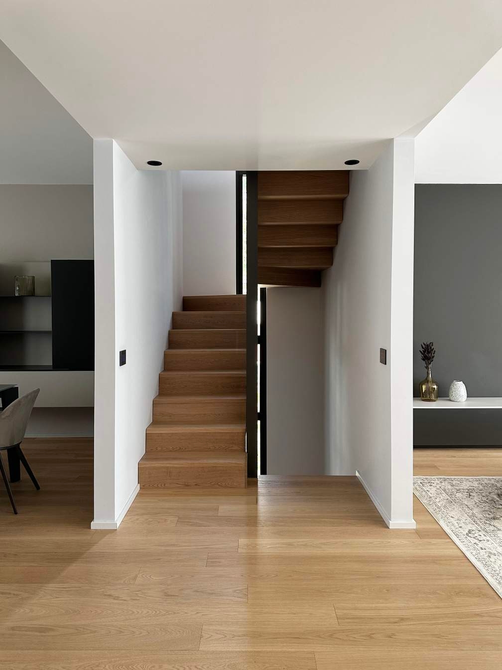 modern interior, wooden stairs, white walls, wooden flooring
