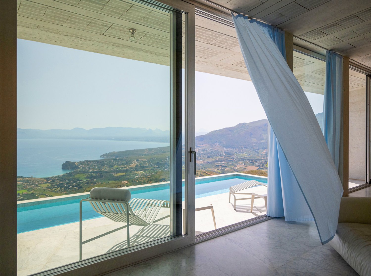 spacious interior, glass sliding doors, pool, lounge chair, ocean view