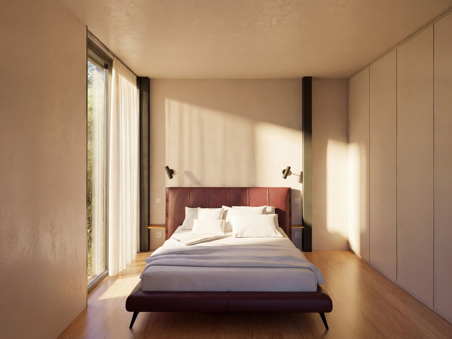 A bedroom with a large bed, white walls, wooden floor, large windows with white curtains, and two wall lamps