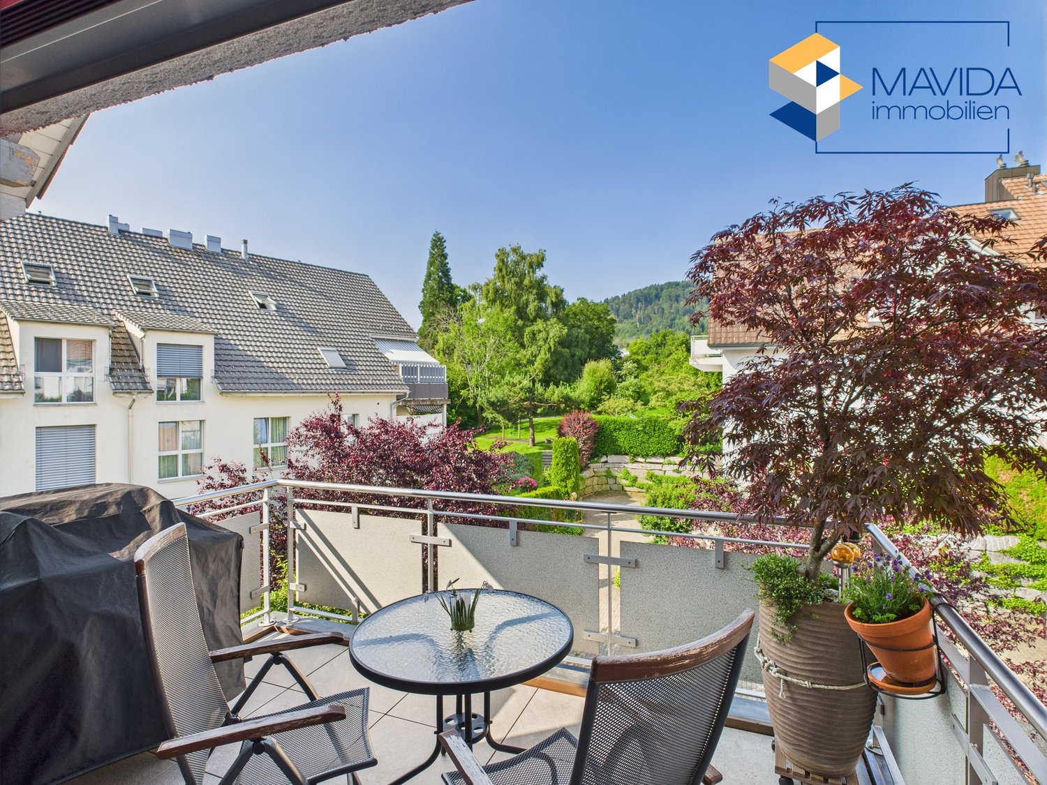 covered terrace with table, chairs, plant, barbecue cover, tree, garden, and house