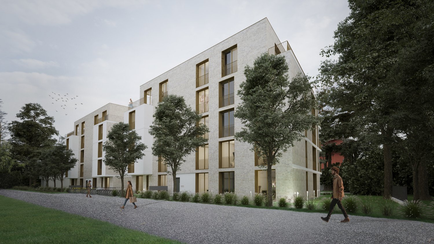 A modern, multi-story apartment building with a clean, minimalist design. The building features large windows and balconies, surrounded by trees and greenery. The exterior is primarily made of light-colored materials, creating a sleek and contemporary loo