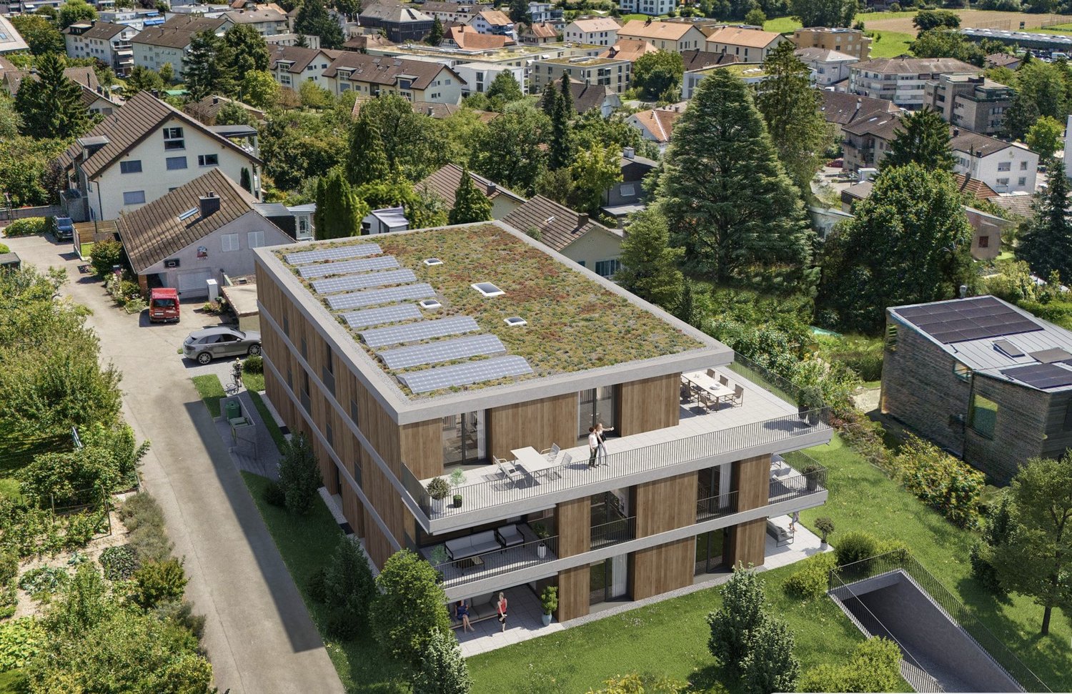 Modern multi-story house with a green roof, solar panels, and a balcony.