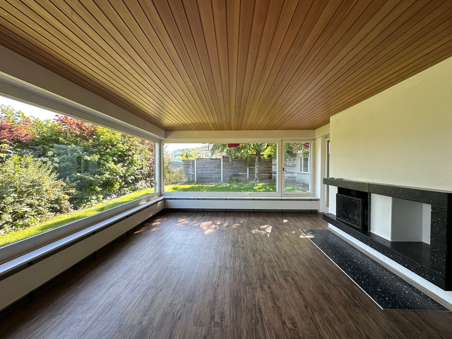 modern design, wooden floors, large windows, fireplace, minimalist