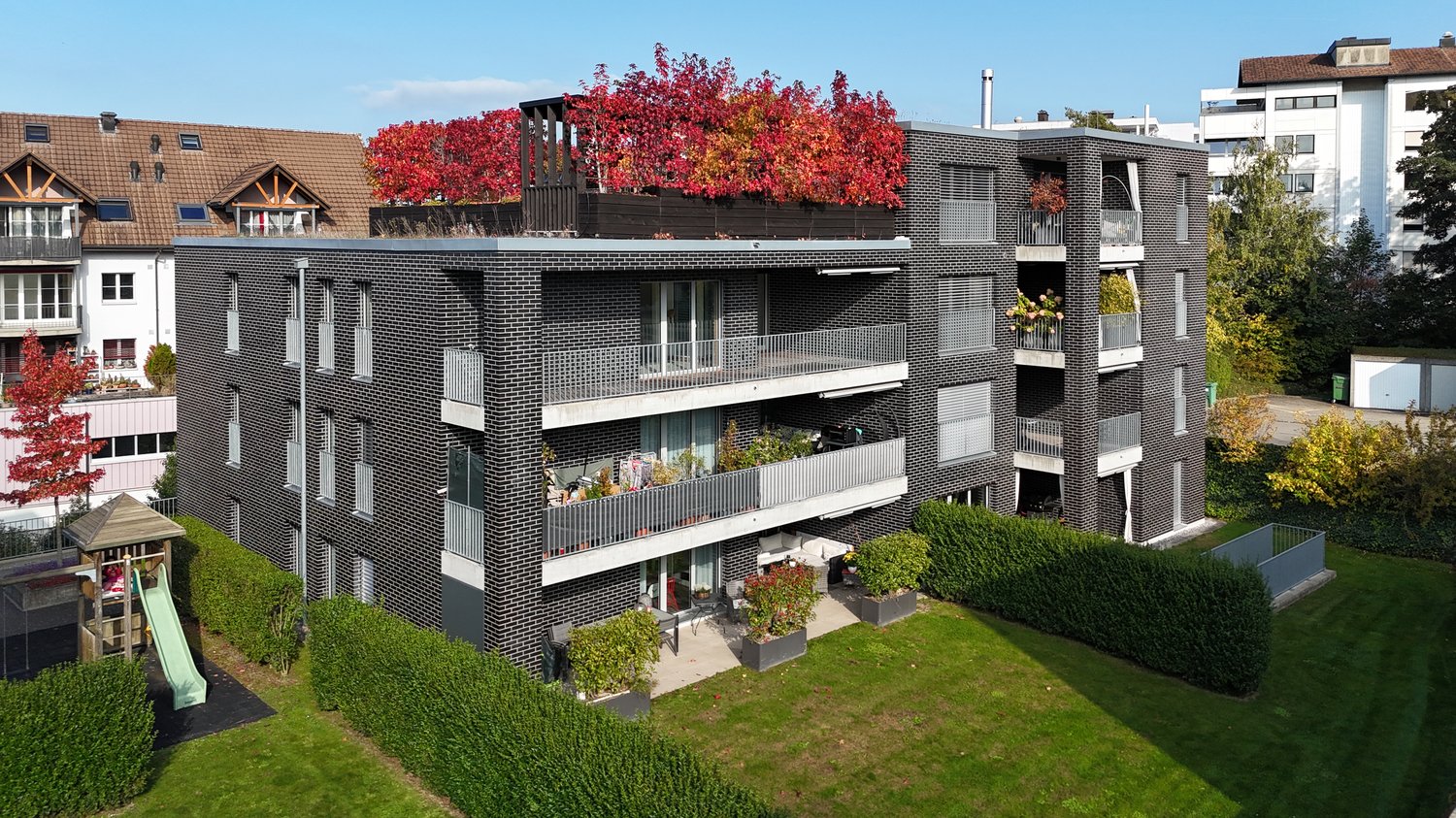 4 story house, black brick, green roof terrace, balconies, garden, slide