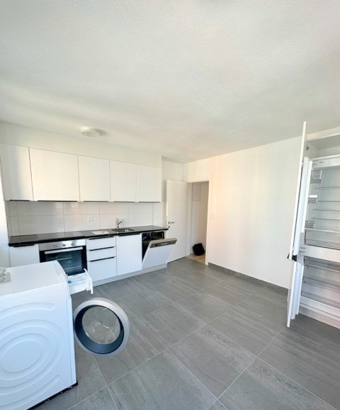 empty room, white kitchen, cabinets, countertop, sink, faucet, dishwasher, washing machine