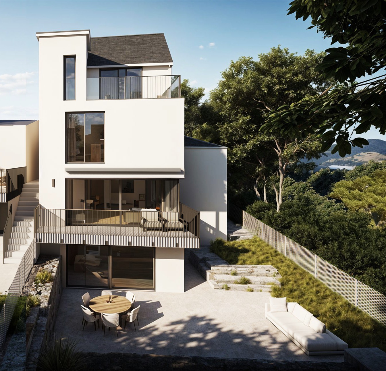 3-story modern house with white exterior, large windows, balcony, raised ground floor, and parking space. The house is surrounded by lush greenery and has a patio with outdoor furniture.