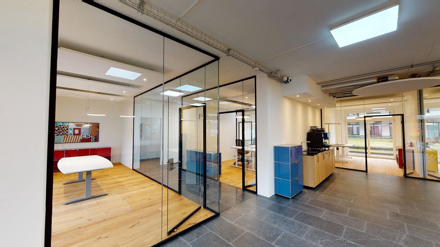 modern office room, glass walls, white desk, wooden floor, wooden cabinets, coffee machine
