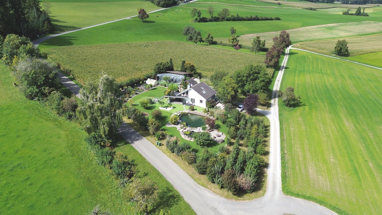 Country house with garden, swimming pool, and a view of the fields