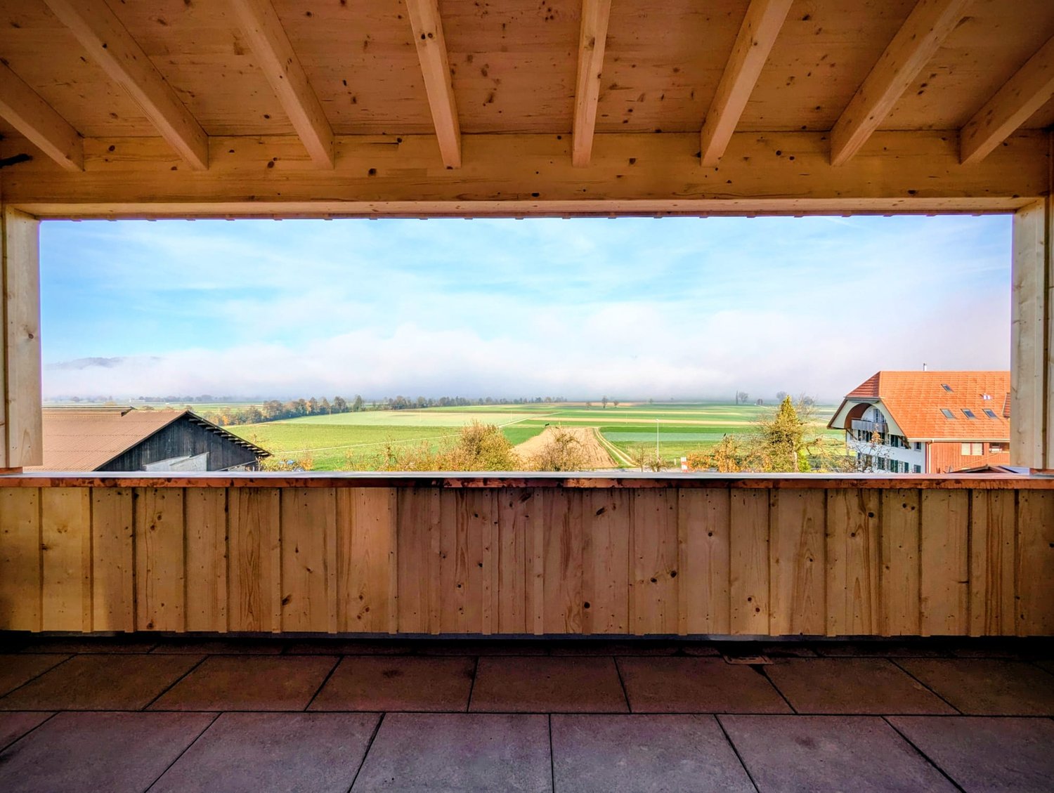 wooden balcony with a view to the landscape