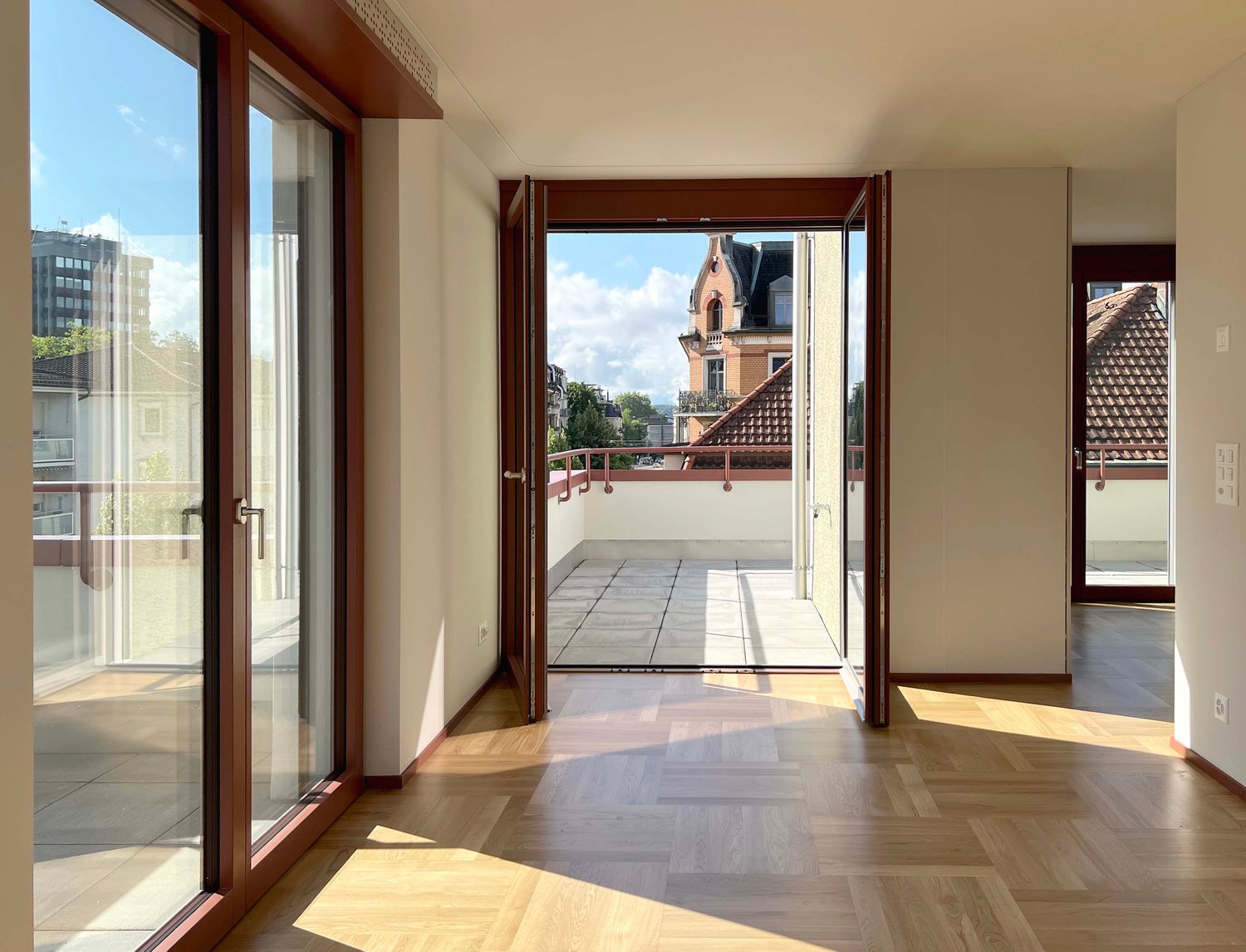 open balcony with tile flooring, wooden parquet flooring, sliding glass doors