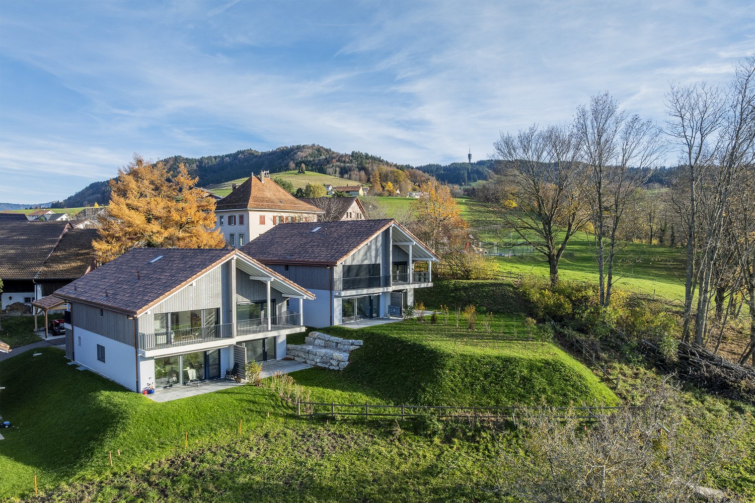 two houses, raised ground floor, balcony, mountain view, green hills, rural location