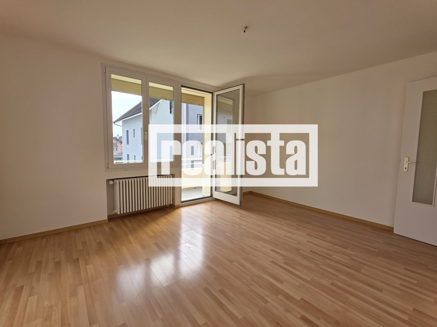 Hardwood floors, open balcony, sliding glass doors, radiator