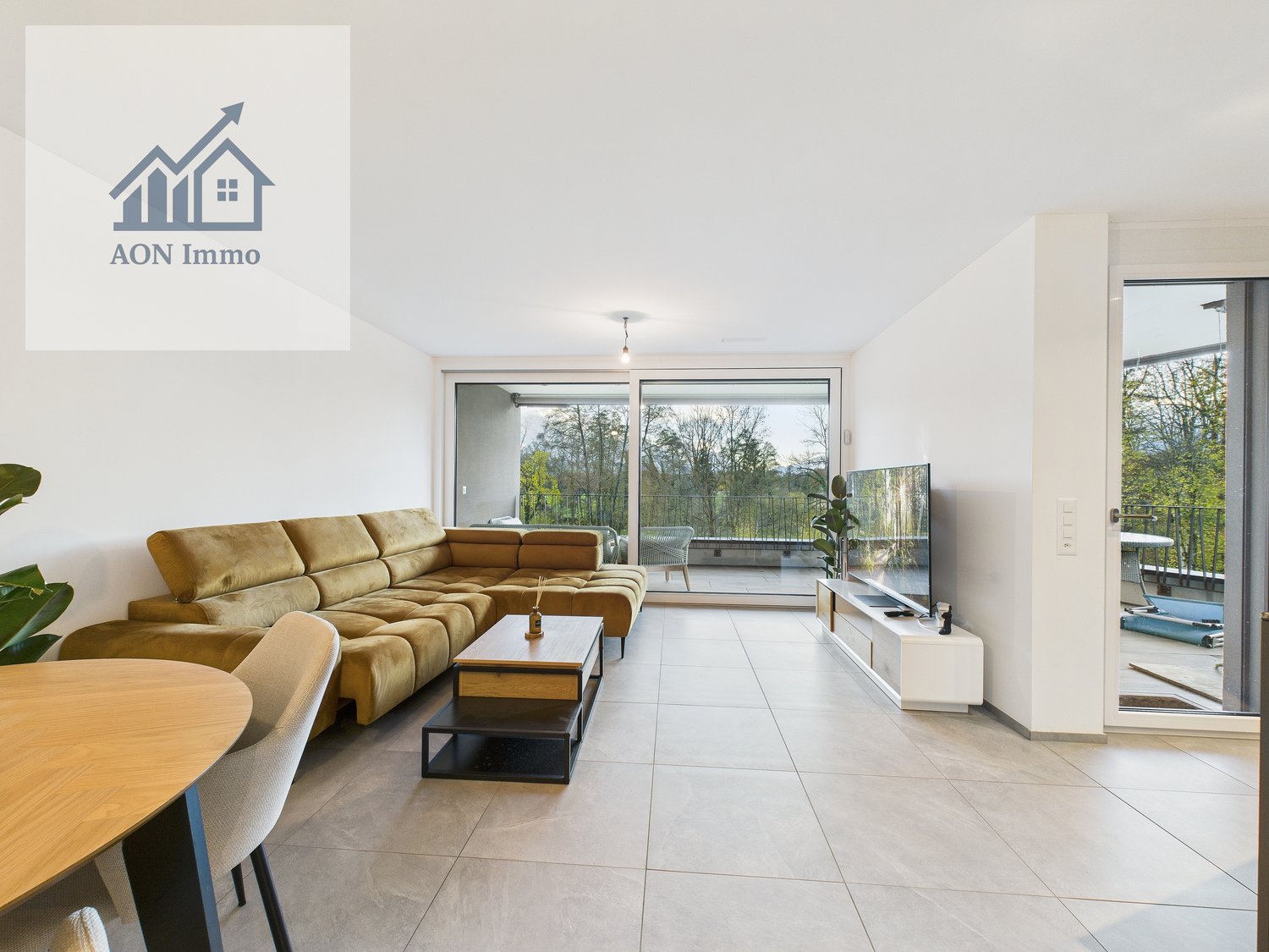 modern design, open floor plan, couch, coffee table, television, glass wall