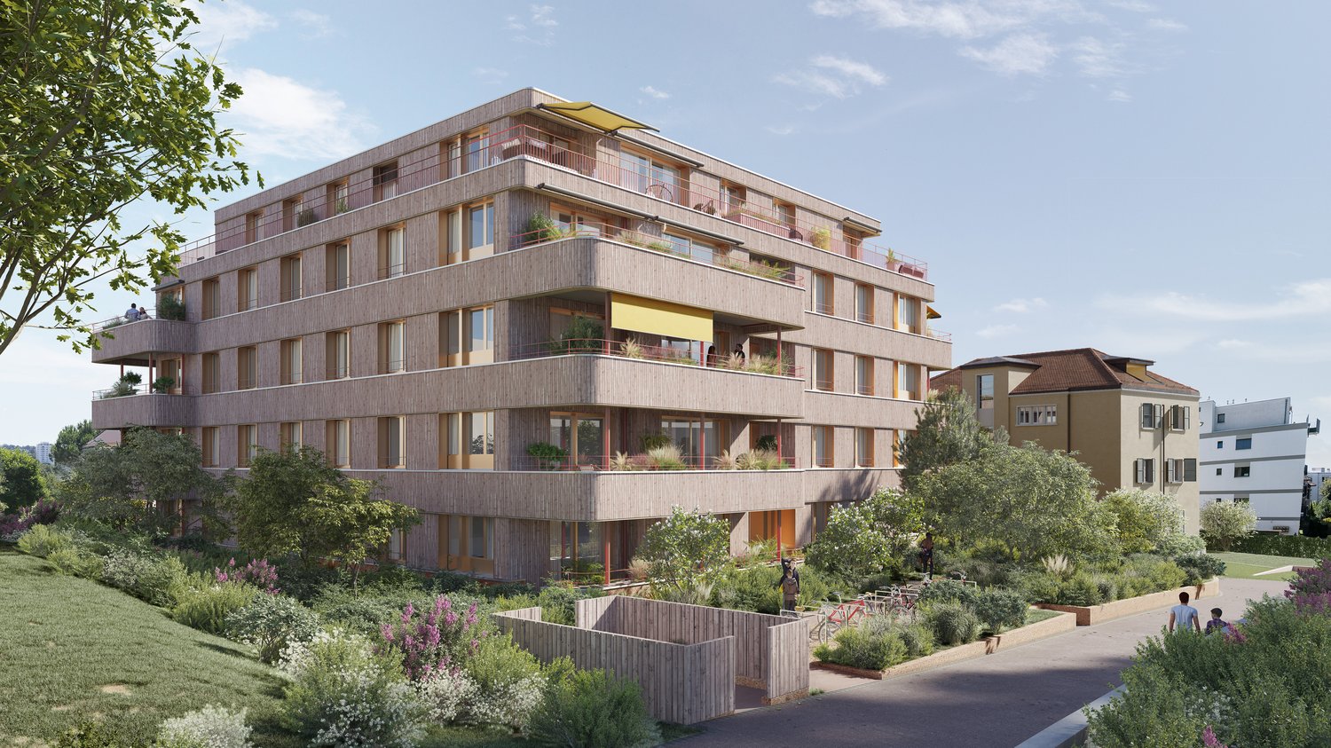 Multi-story apartment building with wooden exterior, balconies, and landscaped gardens surrounding the building.