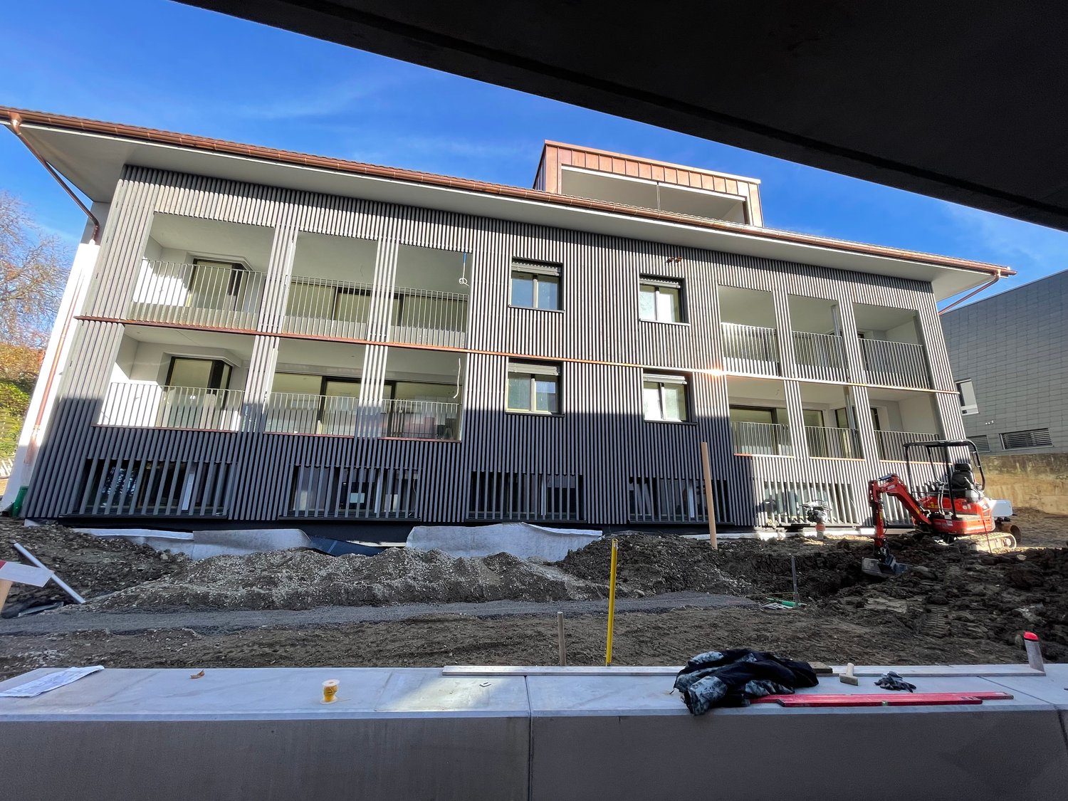 Modern apartment building, balconies, under construction