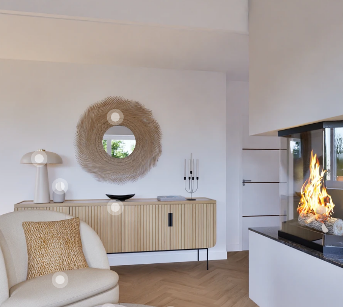 modern living room with beige couch, wood table, wall mirror, decorative fireplace, modern light, candles, fire log