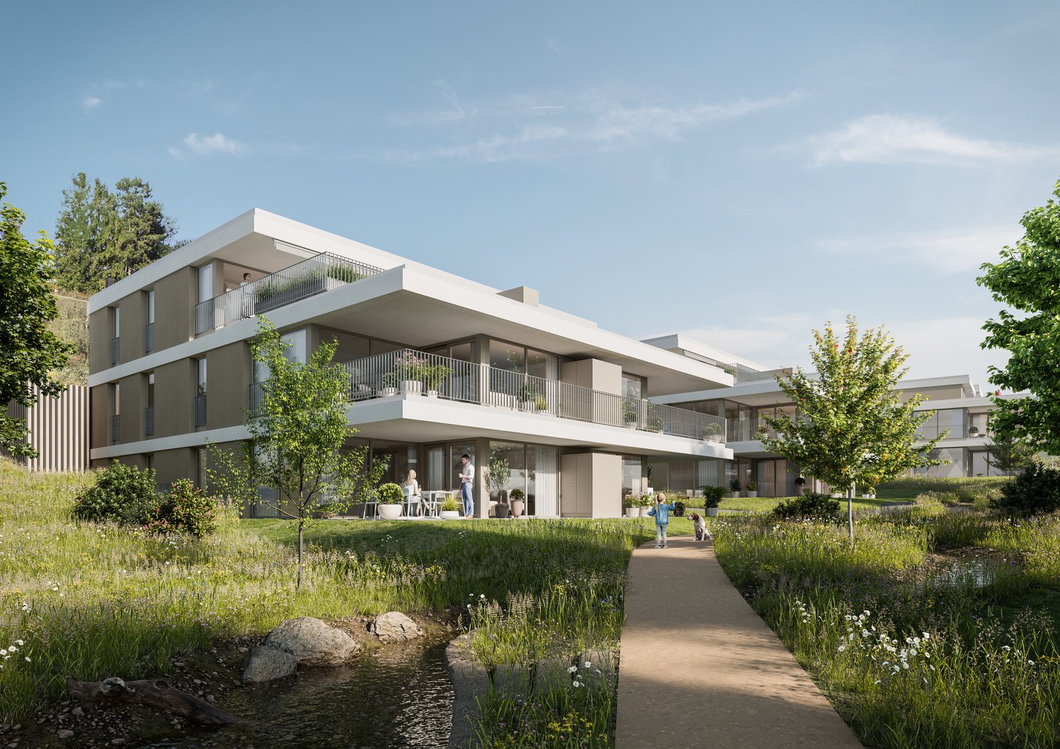 a modern, white apartment building with balconies, located on a hill with a well-maintained garden and a small pond