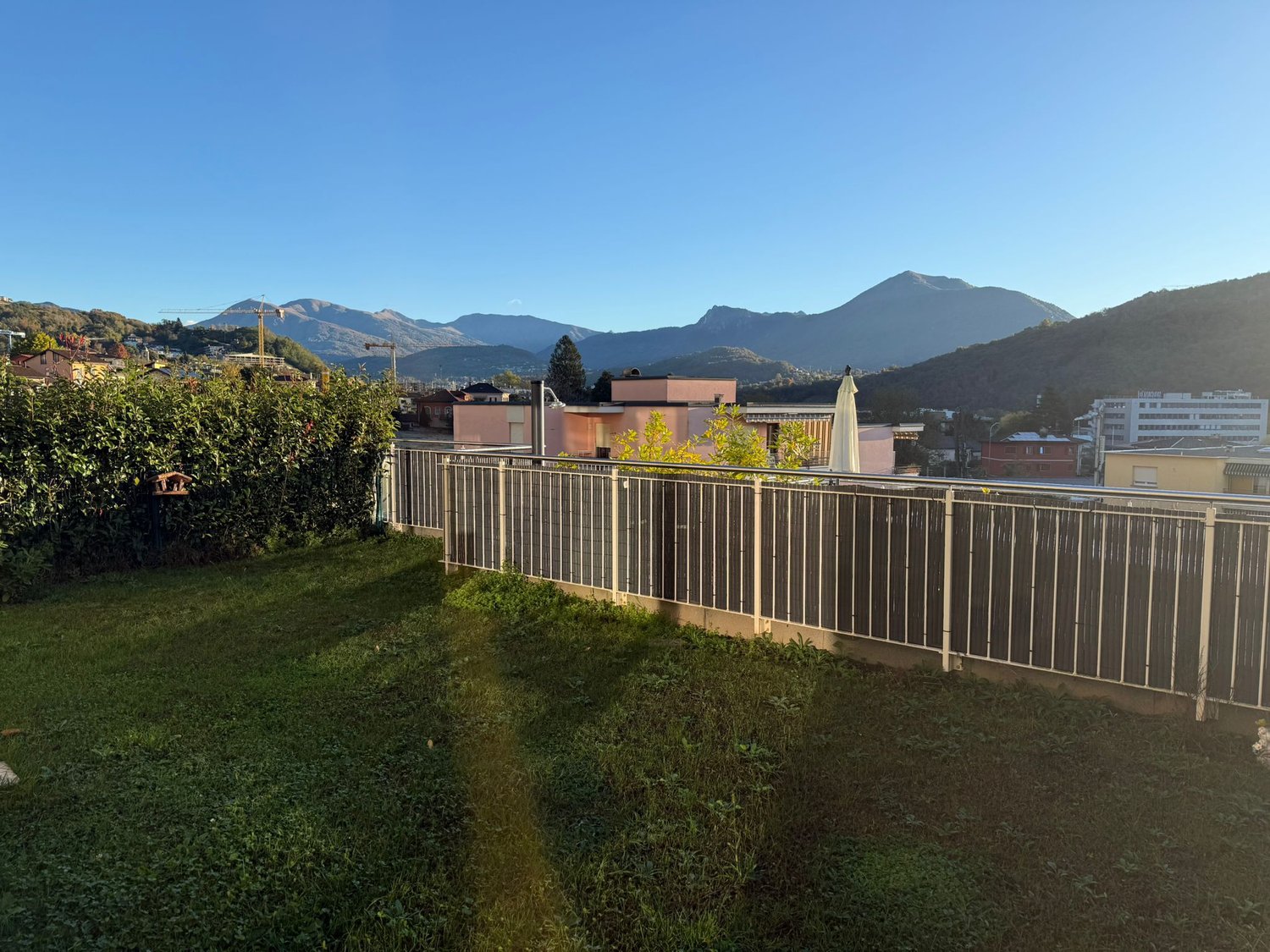 fenced area with a view of mountains