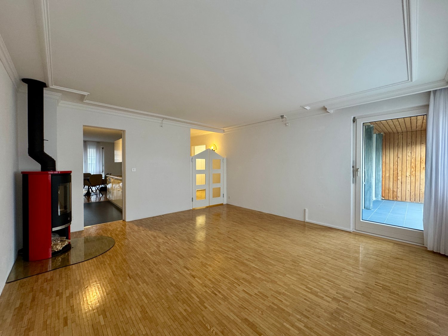 empty room, hardwood floors, fireplace, sliding glass doors to deck