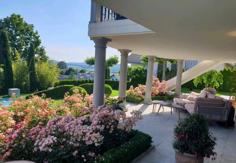 covered terrace with columns, flowers, swimming pool, garden, view of the mountains