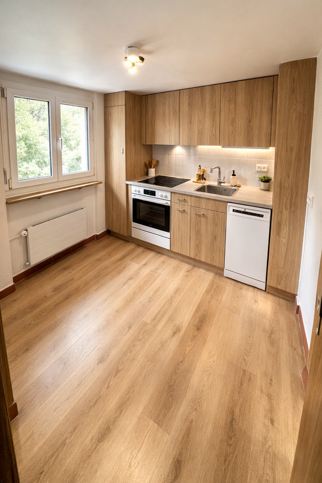 modern kitchen with wooden floors, built-in oven, dishwasher, cabinets, and sink
