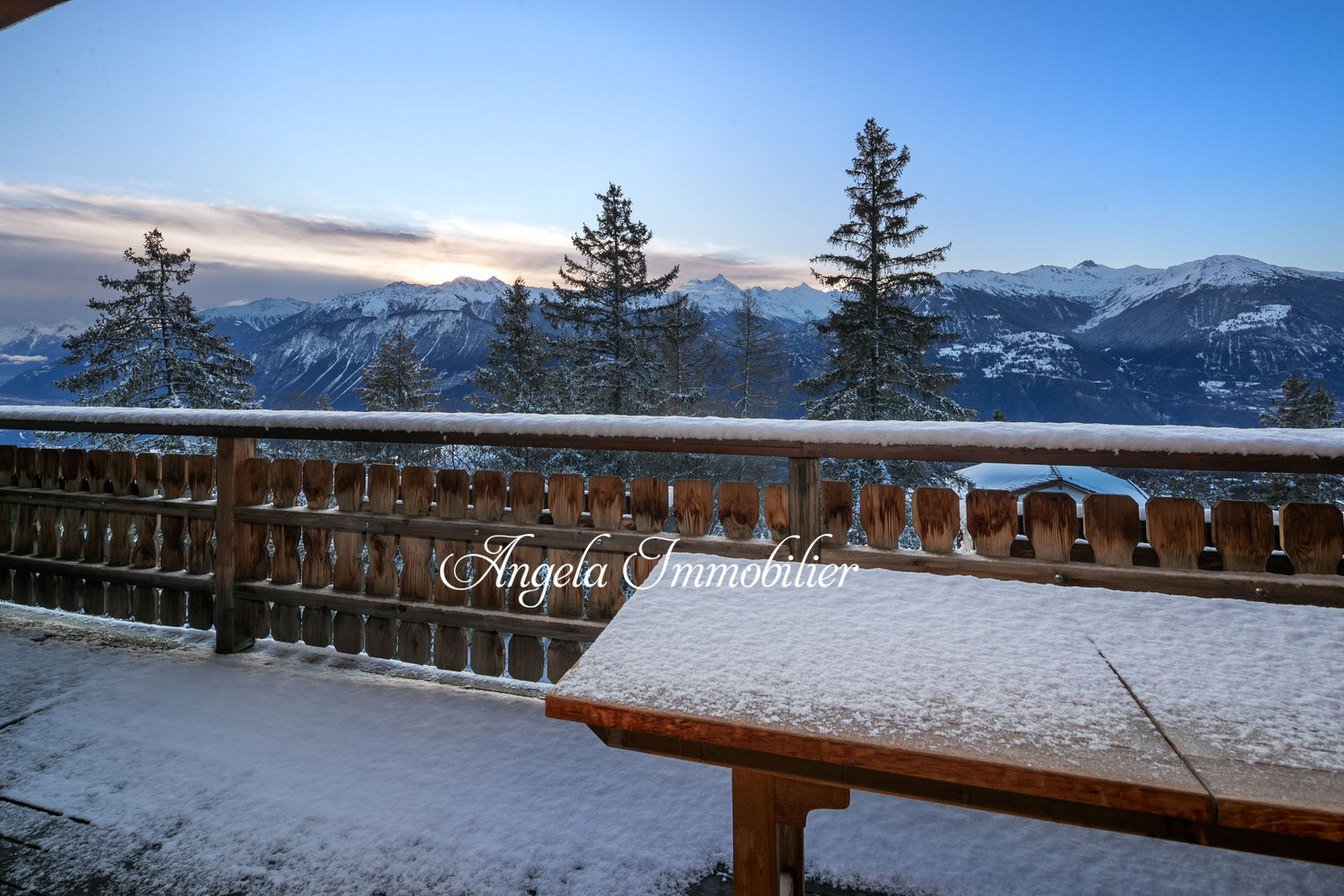 wooden fence, wooden table, snow, mountains, trees