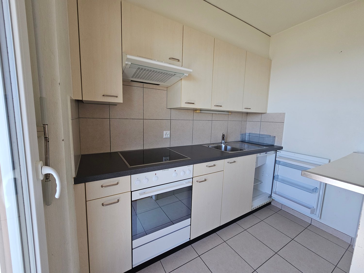 modern kitchen with white appliances, tiled floor, wooden cabinets, sink, stove, dishwasher, refrigerator