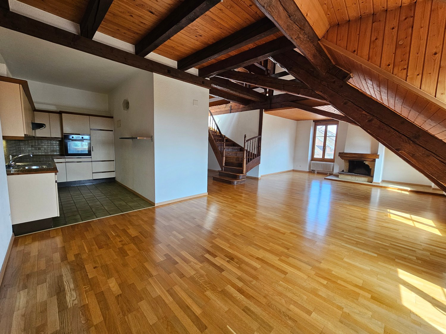 wooden ceiling, hardwood floors, fireplace, kitchen, staircase
