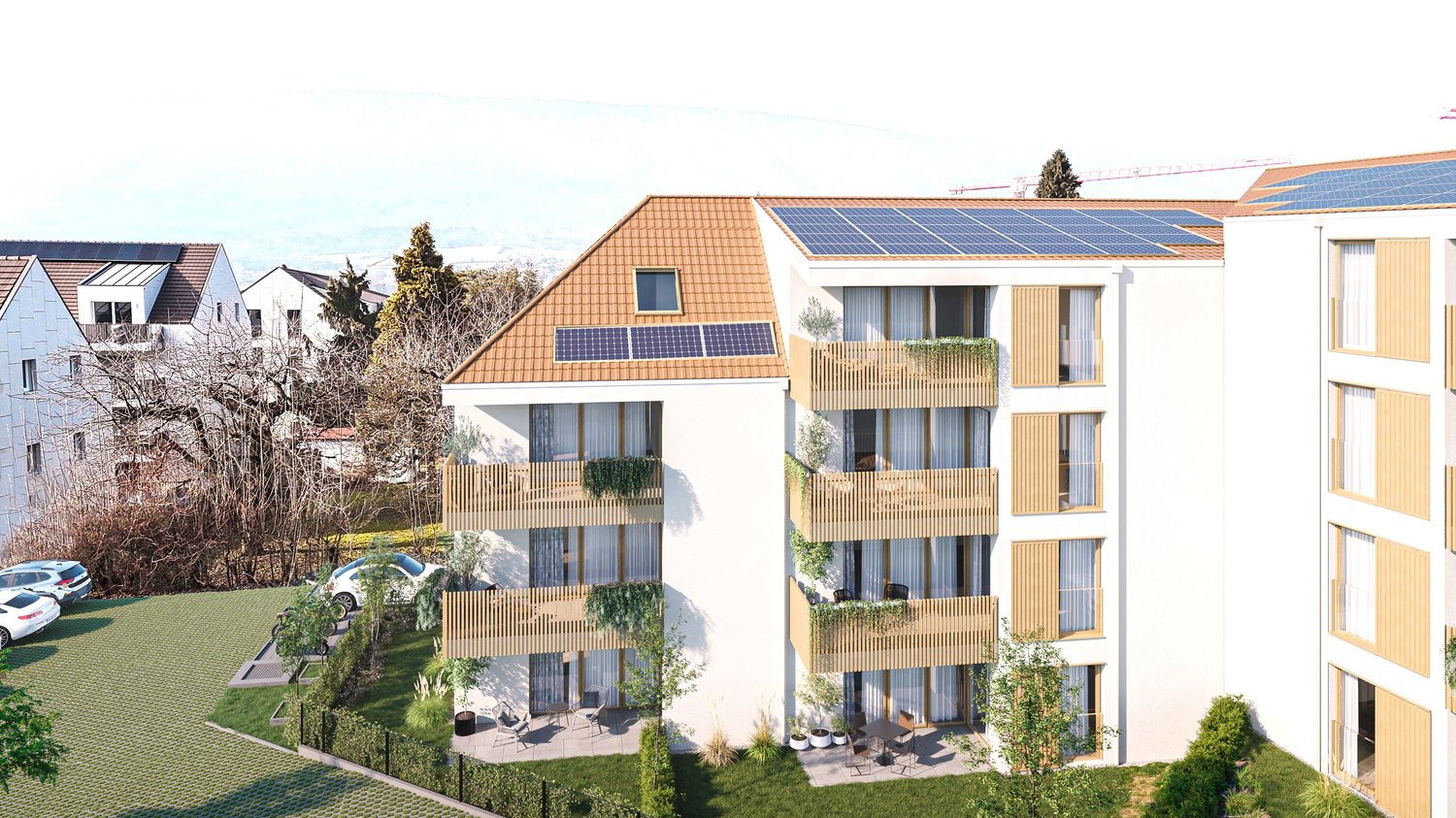 3-story apartment building with wooden balconies, solar panels on the roof, and a parking area in the front. The building has a modern, eco-friendly design with large windows and a green landscaped area surrounding it.