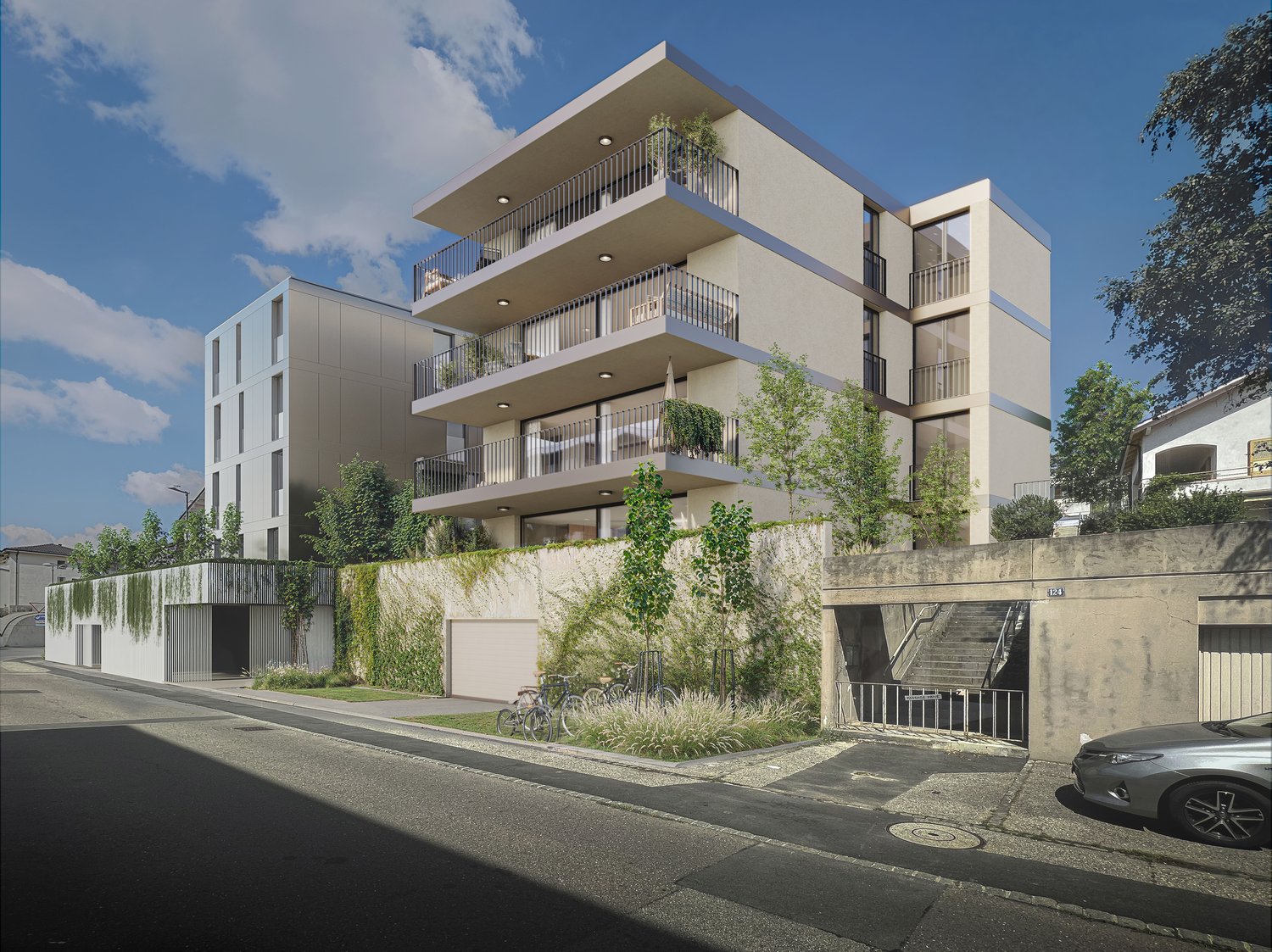 Modern multi-story building with balconies, wall greening, and garages.