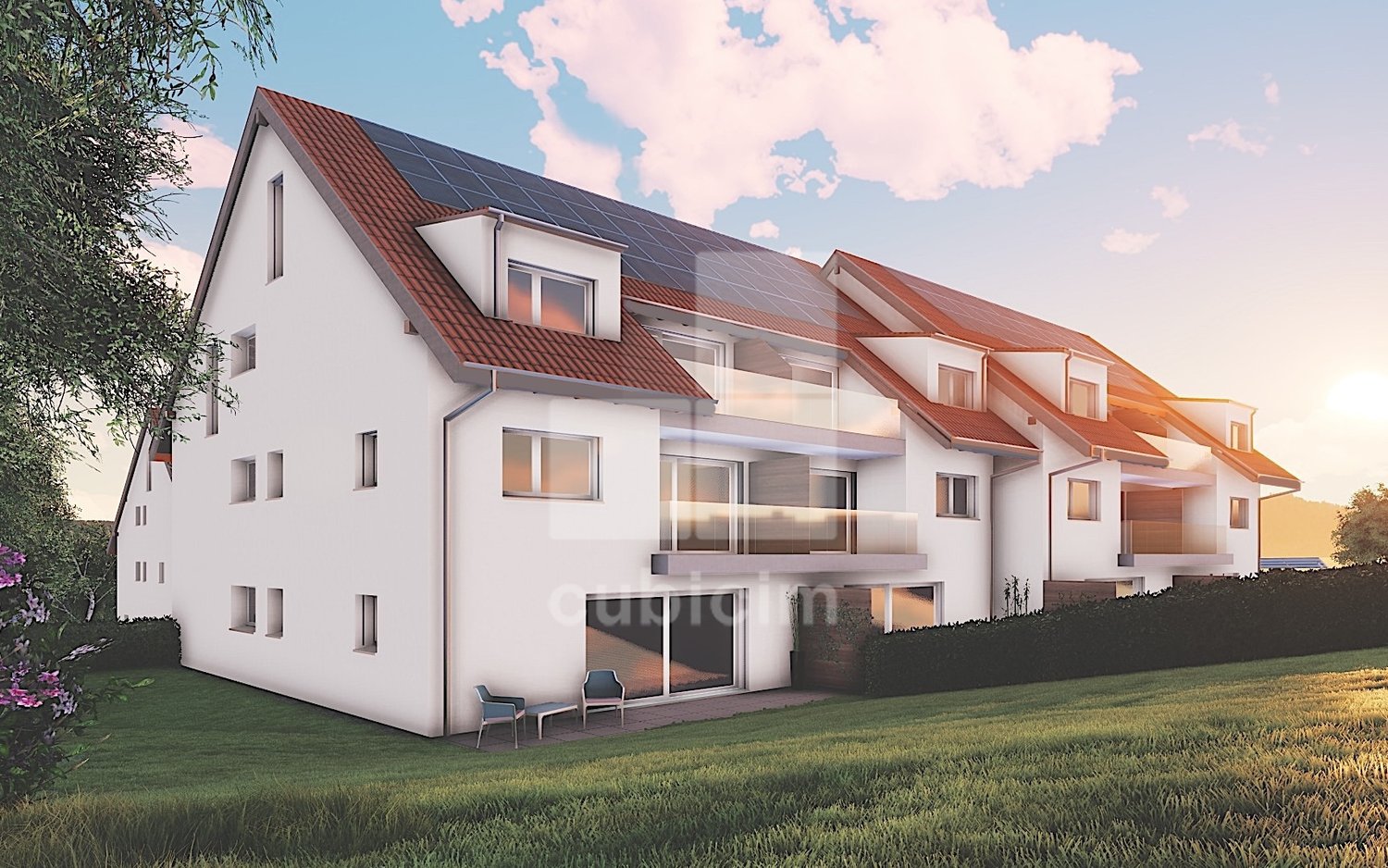 3-story apartment building with red tile roof, white exterior walls, large windows, balconies, and solar panels installed on the roof.