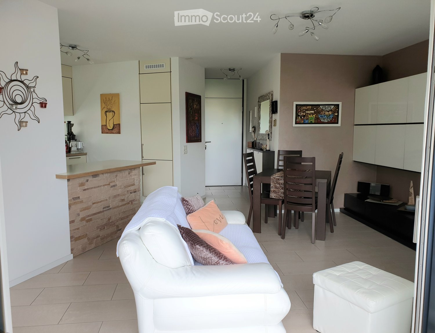 White sofa, dining table, modern decoration, wooden floor, white walls