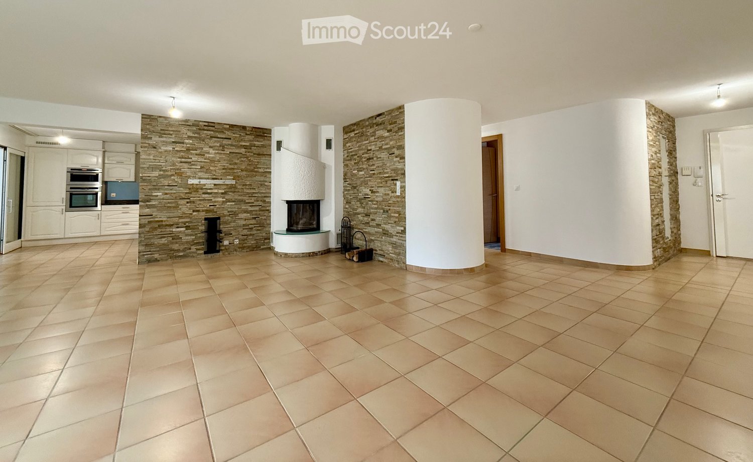 open floor plan, fireplace, built-in oven, kitchen, large windows