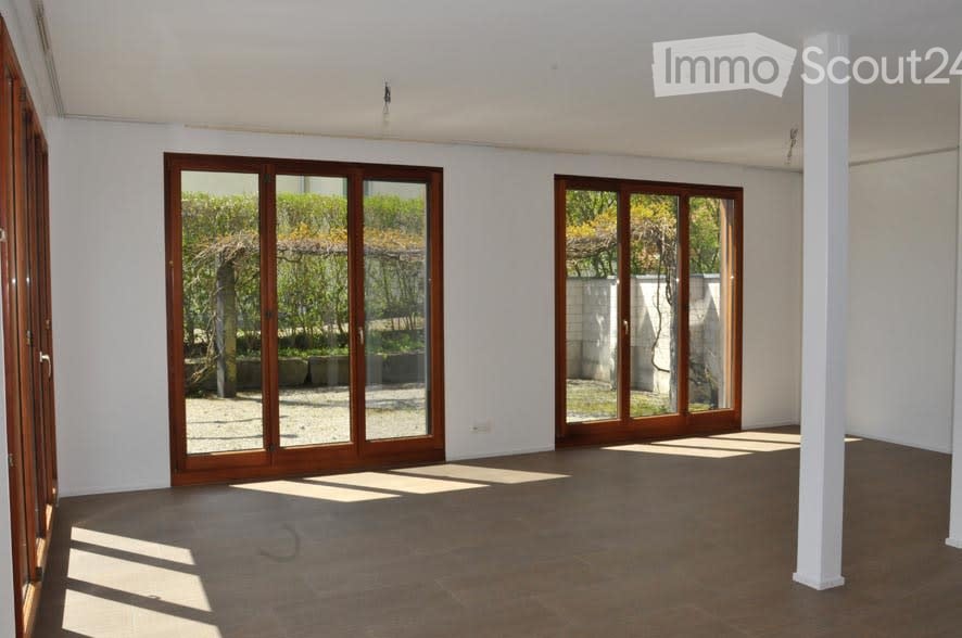 Open space with large glass doors and natural light