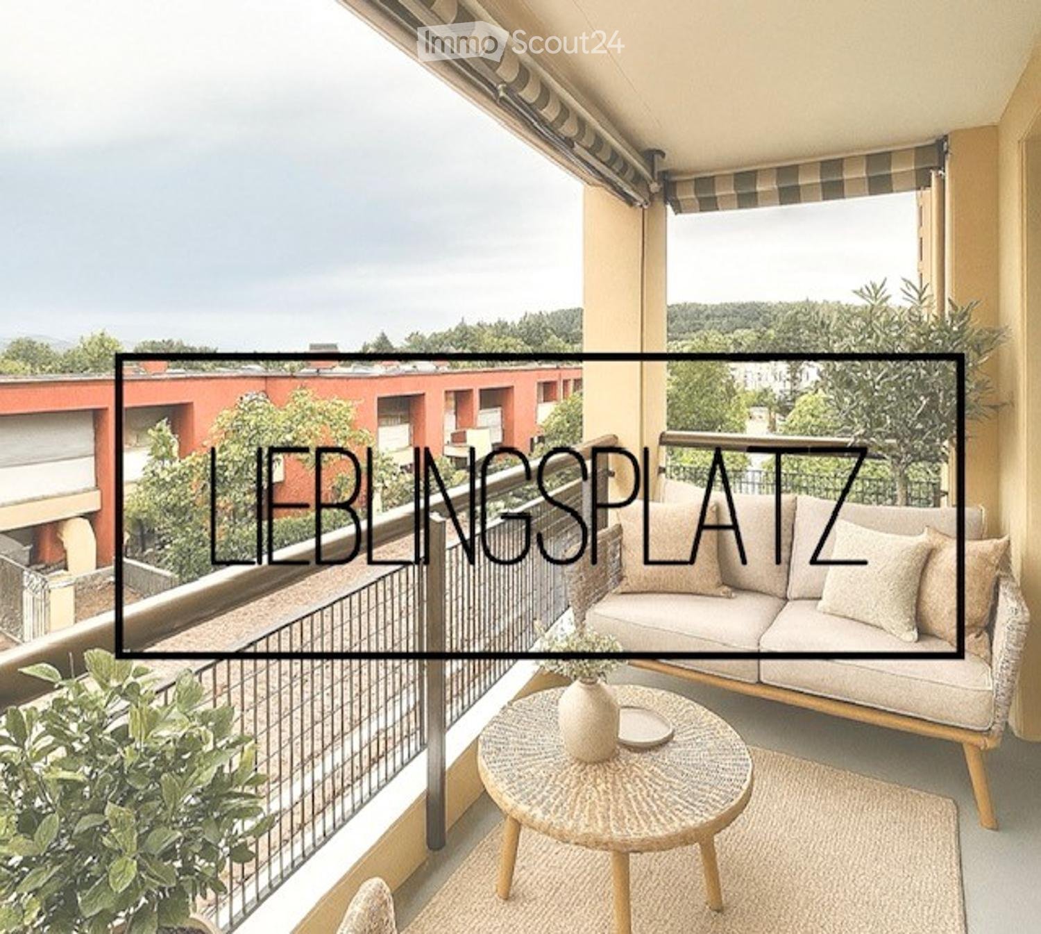 Cozy outdoor seating area with a couch, a small table, and a vase of flowers on the table, with a beautiful view