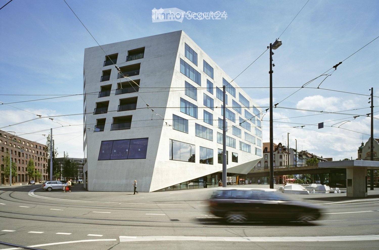 Modern multi-storey house, white exterior, many windows, flat ground floor