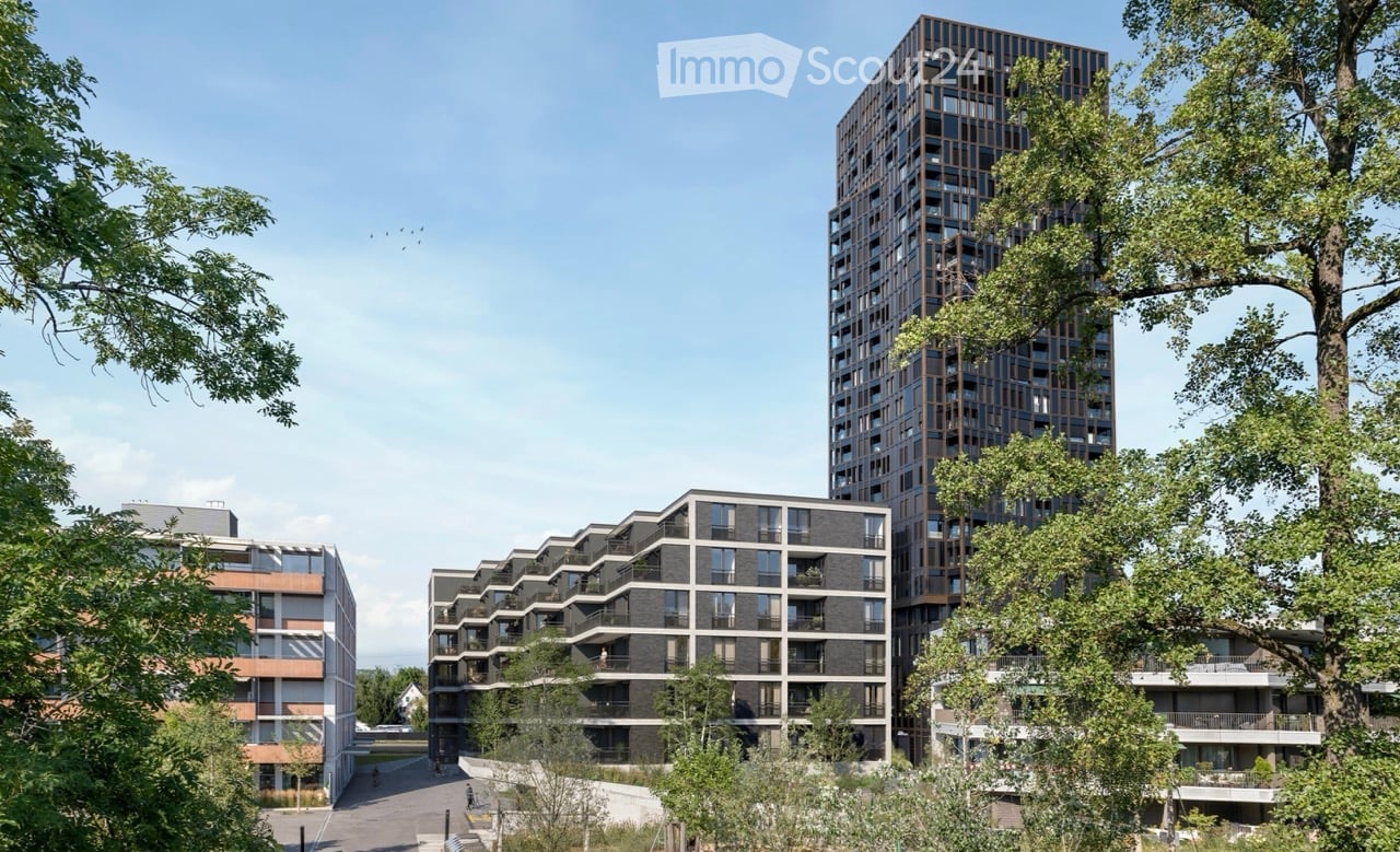 Multi-storey apartment buildings surrounded by trees and greenery.
