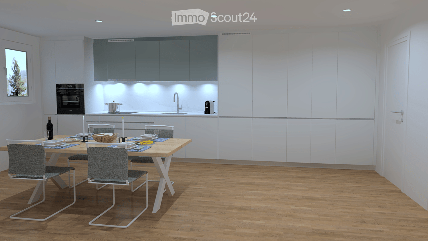 Dining room with open kitchen, white cabinets, wooden floor, island with kitchen sink and oven, a dining table and chairs