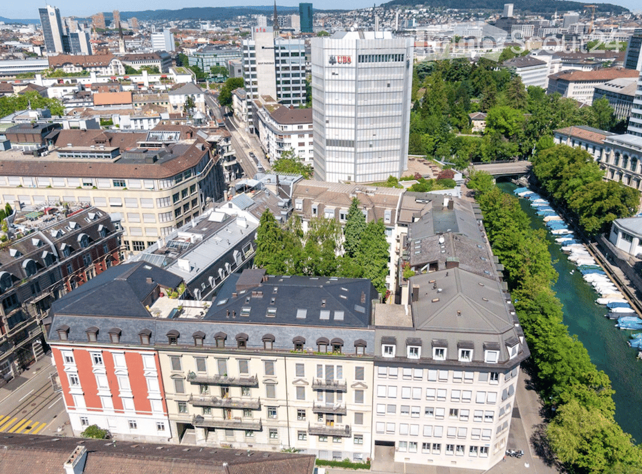 urban area, multiple high-rise buildings, greenery, canal, UBS bank building