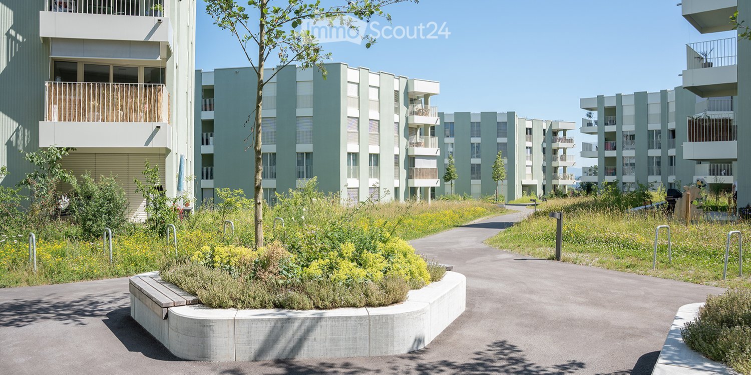 concrete apartment buildings with several floors and balconies