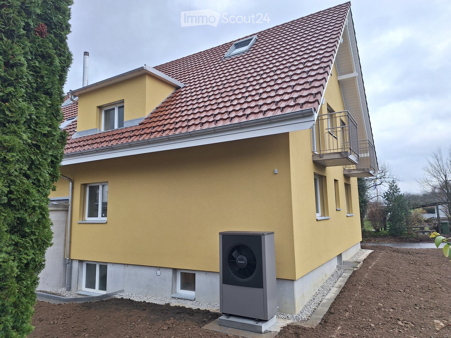 2 story house, yellow wall, red roof, 2 windows, terrace, chimney