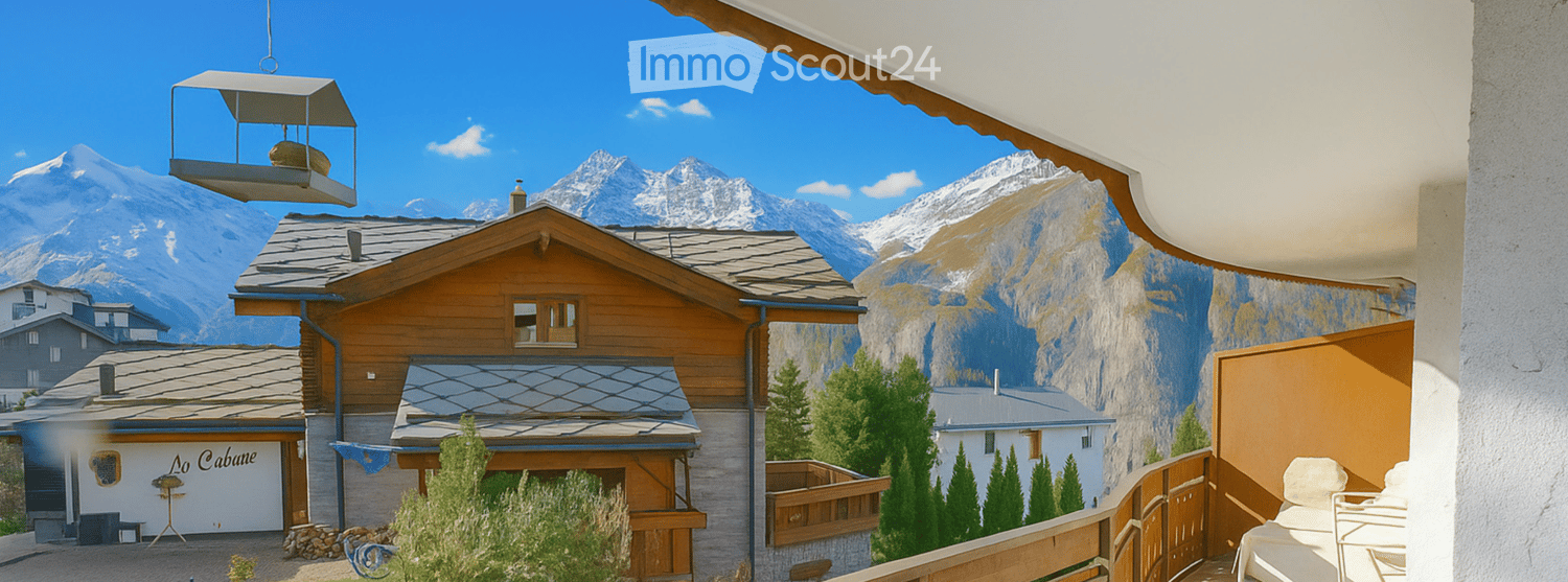 wooden house, terrace, mountains in the background