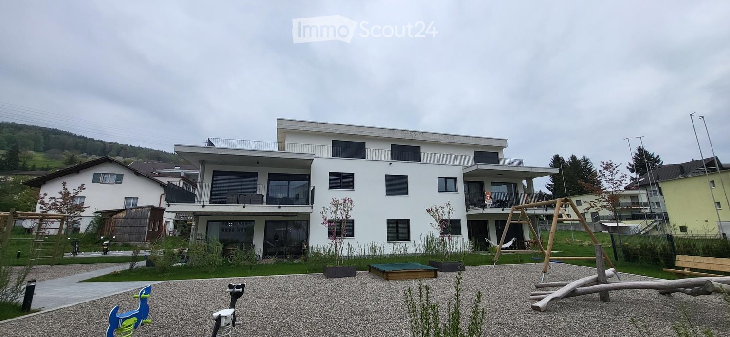 2 story house, white exterior, multiple balconies, modern design, surrounded by greenery