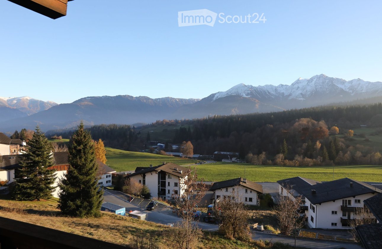 view from the terrace of the houses in a small village surrounded by mountains