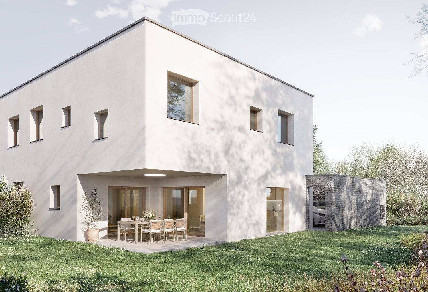 Modern two-story house with white exterior, large windows, and a raised ground floor. Features a patio area with a dining table and chairs, a small garden, and a garage with a parked car.