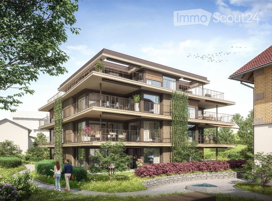 Modern multi-story residential building with multiple balconies, greenery, and a small swimming pool in the foreground.