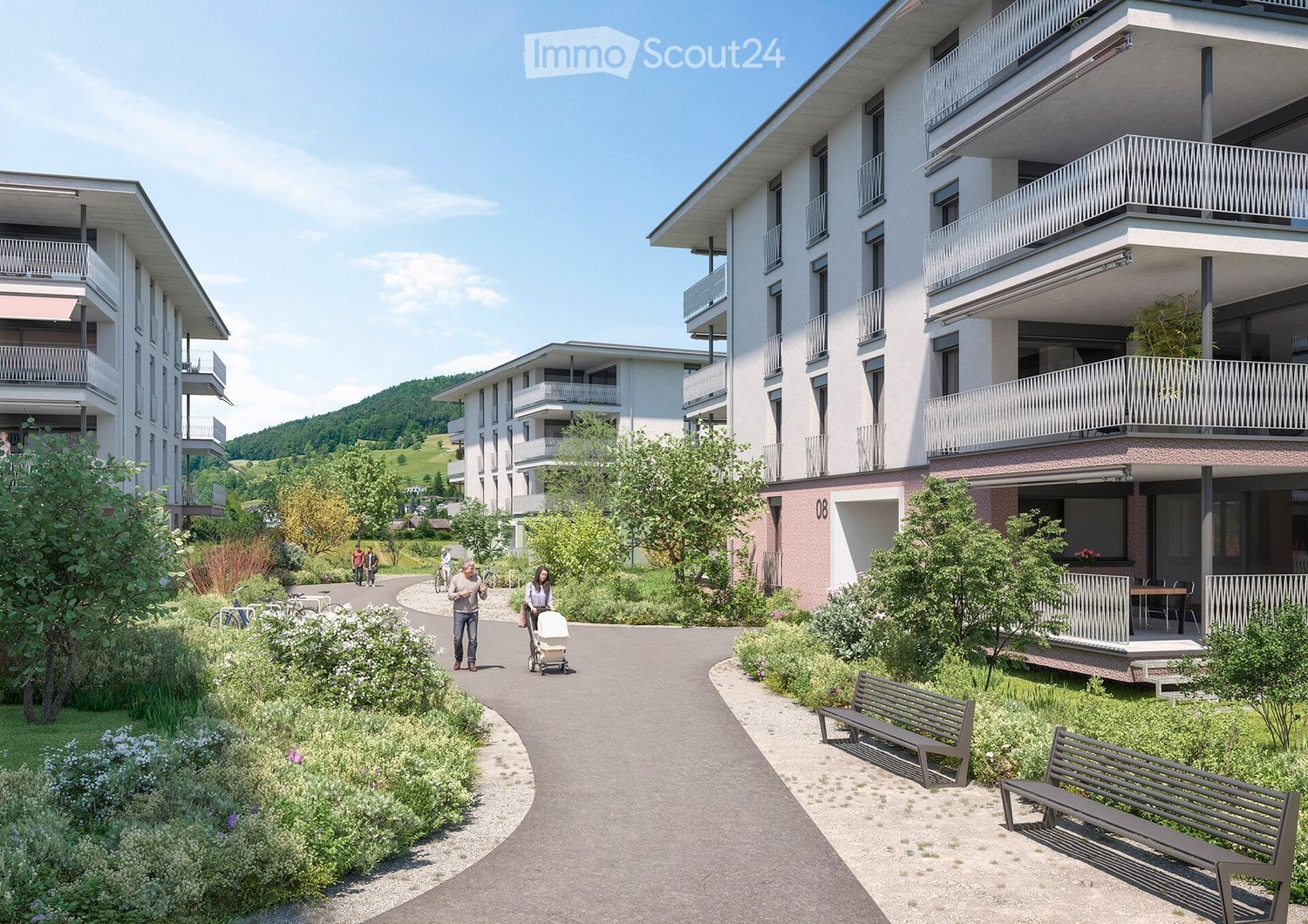 Three story apartment buildings, balconies, paved walkway, benches, greenery