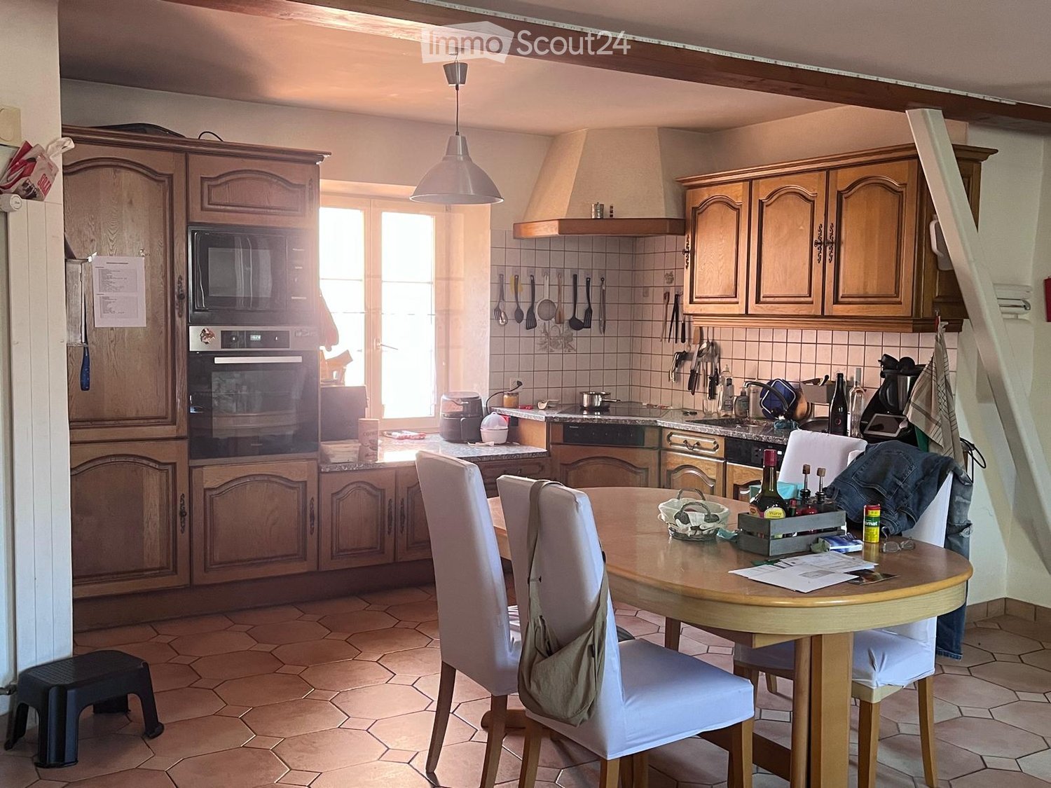 {"type": "Kitchen", "objects": ["cabinet", "oven", "microwave", "table", "chair", "stool", "faucet", "bottle", "cup", "bottle", "bottle", "bottle", "bottle", "bottle", "bottle", "bottle", "bottle", "bottle", "bottle", "bottle", "bottle", "bottle", "bottle