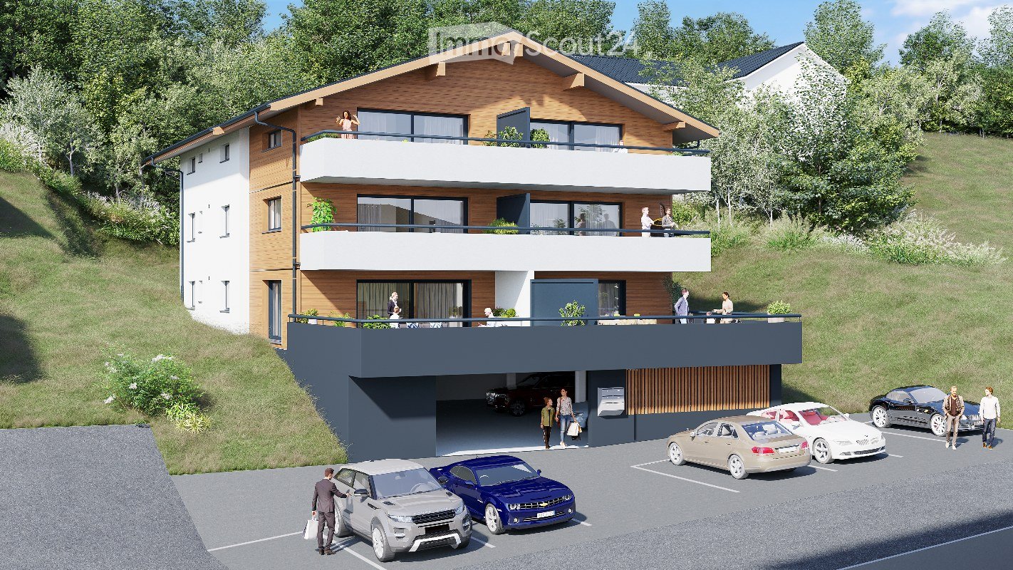 Modern two-story house with balconies, garage, and parking area. The house features a combination of wood and white exterior finishes, with multiple balconies and a raised ground floor.